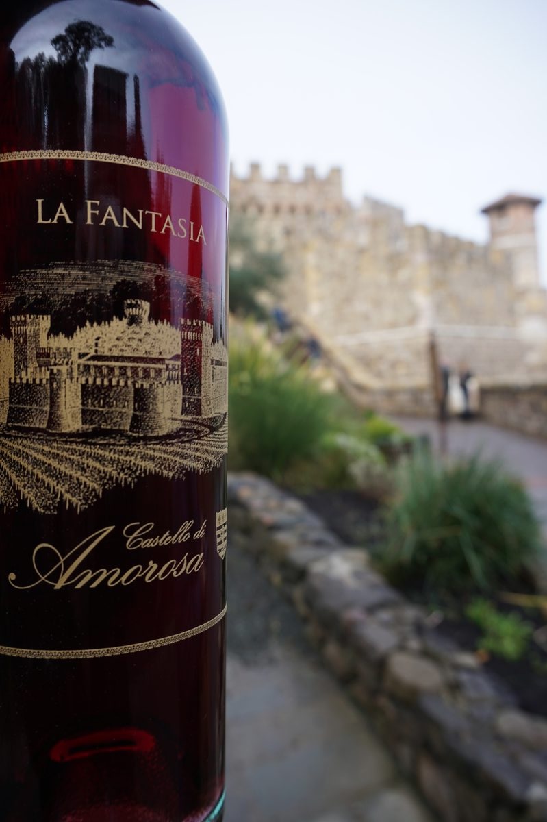 La Fantasia bottle in the foreground with Castello di Amorosa castle behind it, Napa Valley