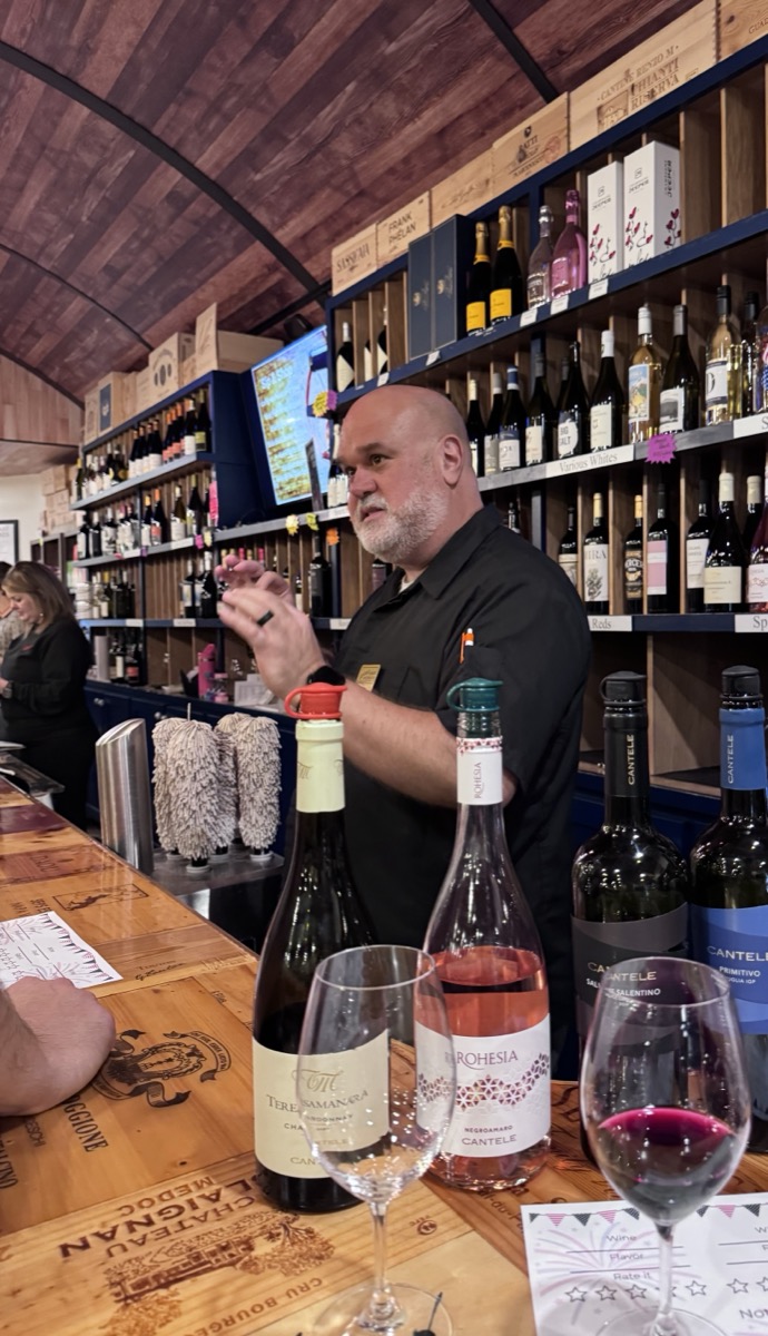 Matt Dinovo guiding a wine tasting at Carfagna's Market & Ristorante